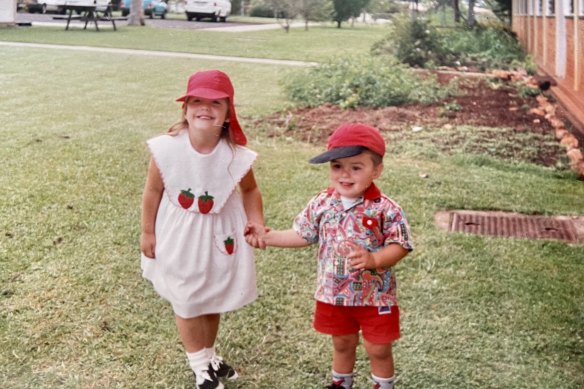 Lech (right) and his sister Hannah in
Wondai, 1994. They were joined at the hip – and dressed in colour-coordinated outfits.