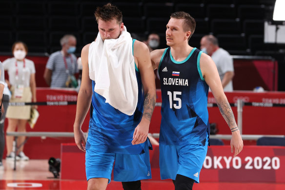 Luka Doncic #77 of Team Slovenia and teammate Gregor Hrovat #15 of walk off the court in disappointment following their loss to Team France.