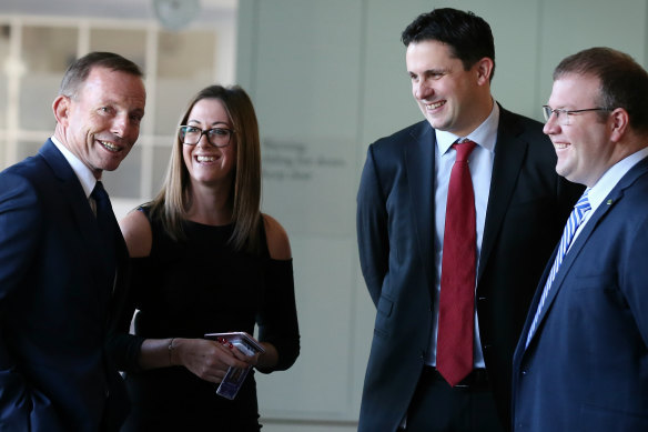Former prime minister Tony Abbott  with former staff members Nicole Chant and Andrew Hirst (second from right) in Canberra in 2017.