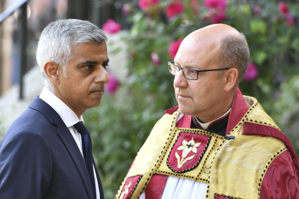 Southwark Cathedral Dean Andrew Nunn speaks with mayor of London Sadiq Khan for a memorial to mark one year since the deadly 2017 London Bridge and Borough Market attack. 