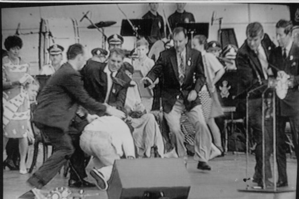 From left, a policeman, then-NSW premier John Fahey and Ian Kiernan rush to subdue an attacker as Prince Charles, right, is ushered away by a security man during an event at Darling Harbour in January 1994.
