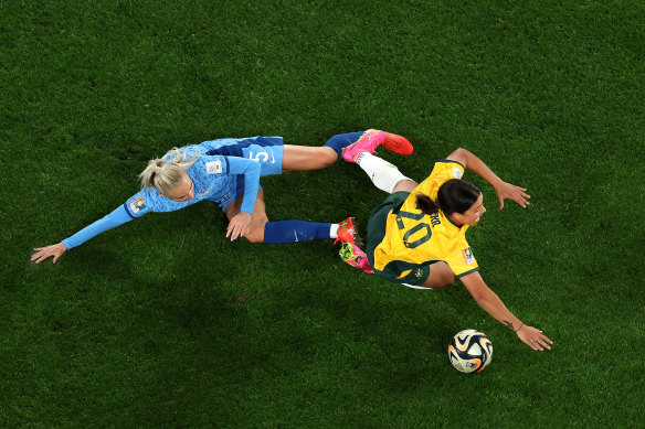 Sam Kerr is fouled by Alex Greenwood.