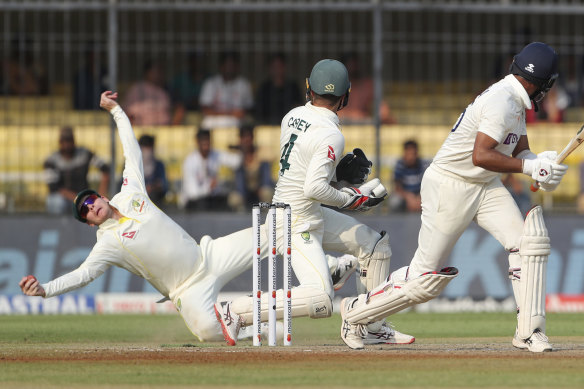 Steve Smith flies to catch Cheteshwar Pujara at leg slip.