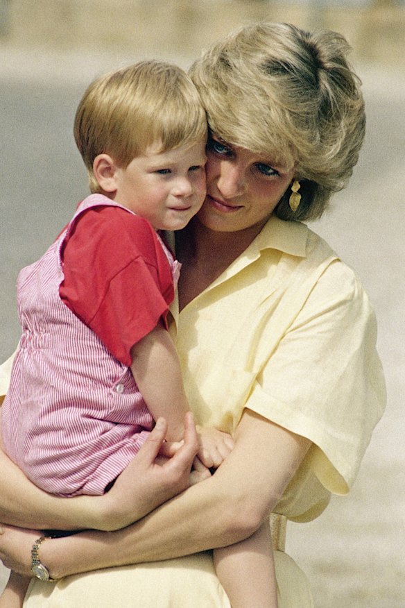 Diana holds toddler Prince Harry during a visit to Spain in 1987.