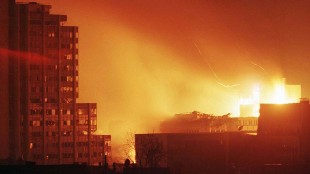 A huge fire rages through central Pristina after a NATO missile strike in April 1999.