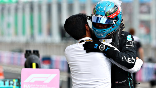 George Russell celebrates his first pole position with Mohammed ben Sulayem, FIA president.