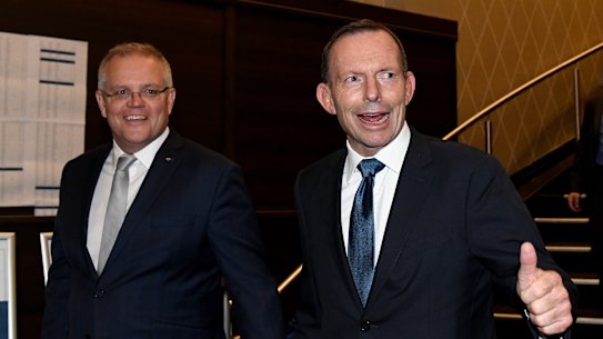 Prime Minister Scott Morrison and former prime minister Tony Abbott arrive at the tribute dinner Thursday night.
