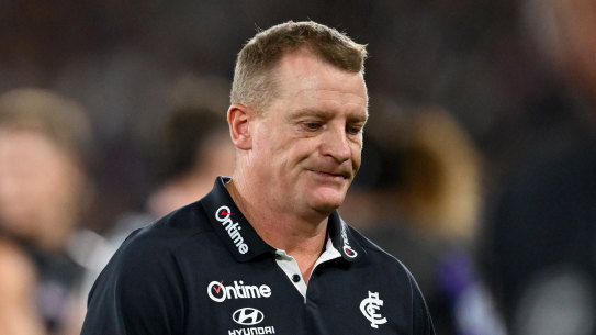 Blues coach Michael Voss walks off after the loss to the Bulldogs.