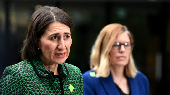 (L-R) NSW Premier Gladys Berejiklian and NSW Chief Health Officer Dr Kerry Chan speak to the media during a press conference in Sydney, Tuesday, March 24, 2020. The state of NSW has shut down all non-essential services to slow the rapidly spreading coronavirus, but schools remain open for now. (AAP Image/Bianca De Marchi)