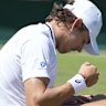 Alex de Minaur of Australia sits on the grass after a fall during his second round match against Jaume Munar of Spain at the Alex de Minaur during last year’s Wimbledon campaign.