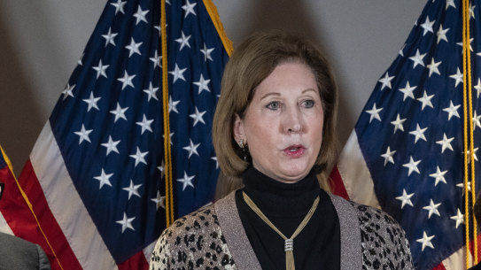 Sidney Powell, right, speaks next to former Mayor of New York Rudy Giuliani, as members of President Donald Trump’s legal team in 2020 