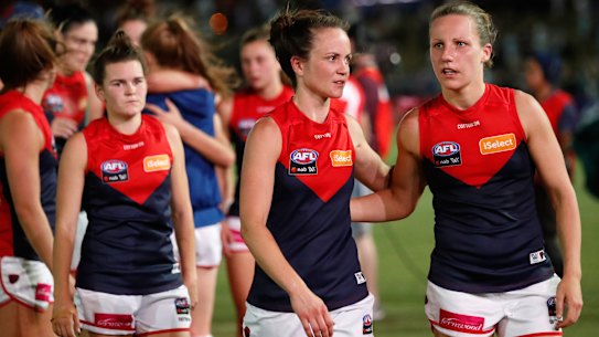 Demons despair: (from right) Karen Paxman, Daisy Pearce and Lily Mithen after the 2018 loss.