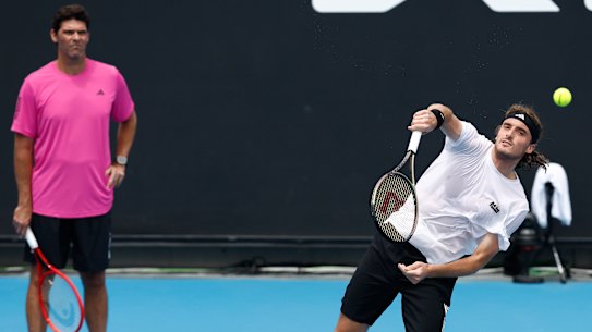 Philippoussis keeps a watchful eye on Tsitsipas at Melbourne Park.