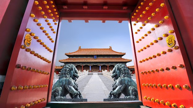 Red entrance gate opening to the Forbidden City in Beijing.