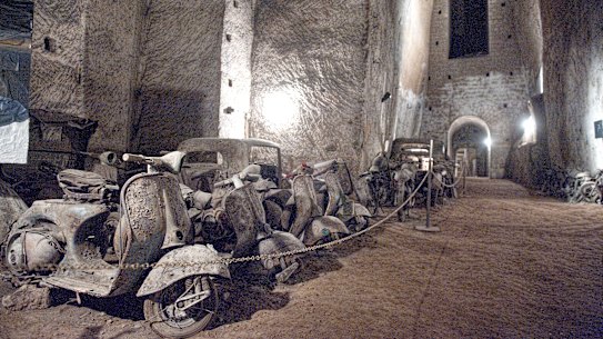The remains of vintage cars and motorcycles in the Borbone family’s tunnel.