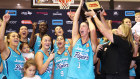 The Southside Flyers celebrate with the WNBL trophy earlier this year.