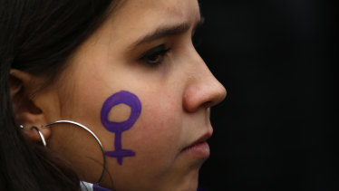 A woman takes part during a protest against sexism and gender violence in Madrid, Spain, on Sunday.
