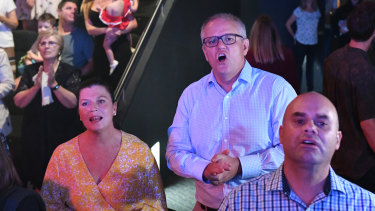 Prime Minister Scott Moorrison sings in prayer with his wife Jenny at Horizon Church in April, 2019.