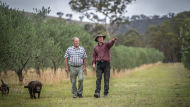 Wallaroo farmers Ross Hampton and Phil Peelgrane say their rural lifestyle is being destroyed by Canberra's building boom.