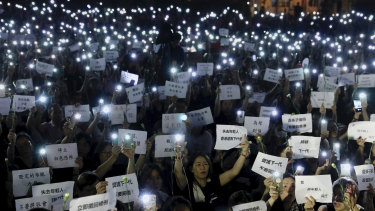 Hundreds of mothers holding placards, some of which read "If we lose the young generation, what's left of Hong Kong", and lit smartphones protest against the amendments to the extradition law in Hong Kong.