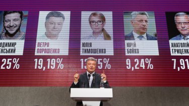 Ukrainian President Petro Poroshenko gestures while speaking at his headquarters after the election in Kiev.