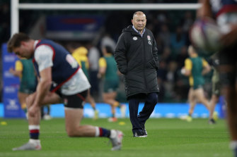 England coach Eddie Jones sees his players warm up before taking on the Wallabies.
