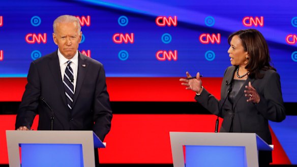 Former vice-president Joe Biden listens as Senator Kamala Harris speaks on the second day of the second round of Democrat debates. 