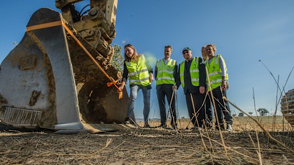 ACT Housing Minister Yvette Berry, Suburban Land Agency chief John Deitz, Brian Corkhill,  Riverview Developments managing director David Maxwell and Green Building Council of Australia chief Romilly Madew at a sod-turning ceremony to mark the start of construction on the Ginninderry housing development.