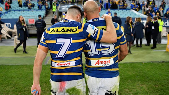Mitchell Moses and Tim Mannah together after a game against the Bulldogs in 2018.