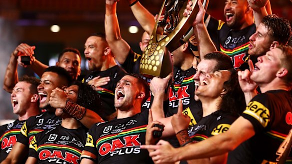 The Panthers celebrate with the NRL premiership trophy after victory in the 2021 grand final in Brisbane.