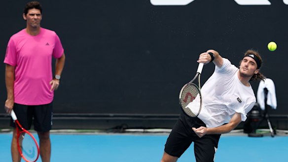 Philippoussis keeps a watchful eye on Tsitsipas at Melbourne Park.