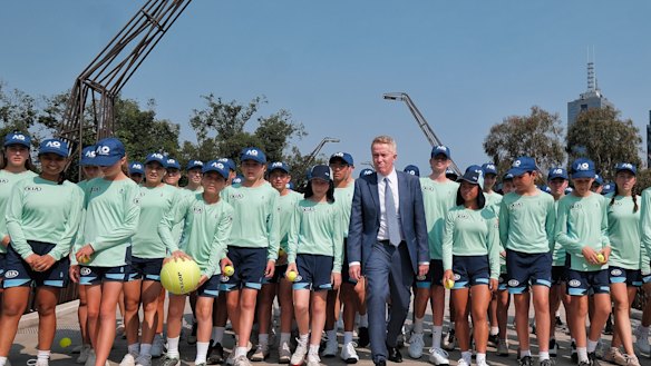 Craig Tiley poses with ball kids before this year's Australian Open in Melbourne.