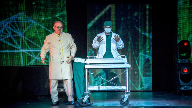 The Inventor (Kevin James), left,  performs some surgery in <i>The Illusionists: Direct from Broadway</i>.