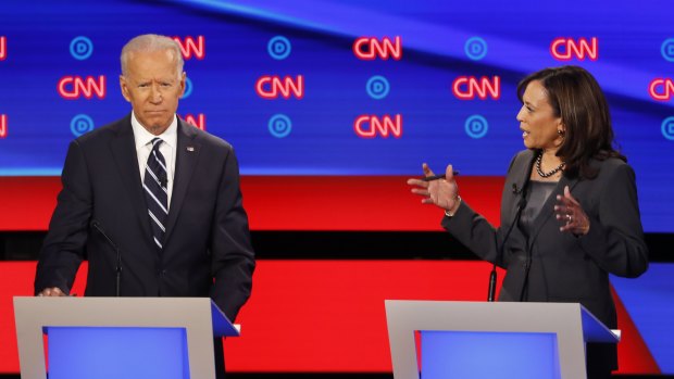 Former vice-president Joe Biden listens as Senator Kamala Harris speaks on the second day of the second round of Democrat debates. 