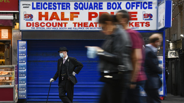 A man wears a face mask in Leicester Square, in London on Tuesday.