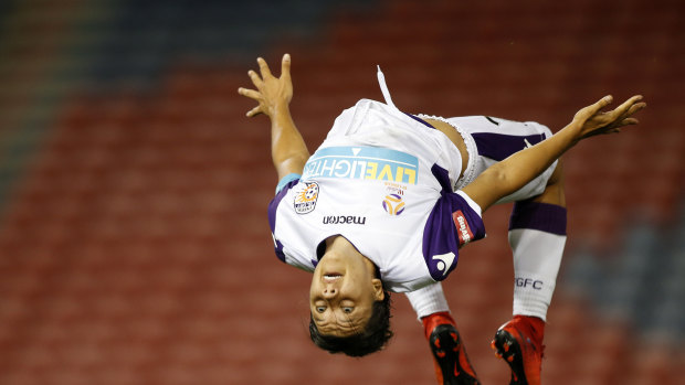 Sam Kerr does a backflip after scoring a hat-trick for Perth Glory during the W-League Round 8 match between the Newcastle Jets and Perth Glory in 2017.