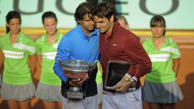 Rafael Nadal with Roger Federer, after beating the Swiss in the 2011 French Open final.