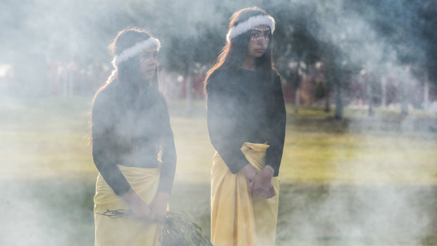 Bella and Bo House at a smoking ceremony to mark Reconciliation Day in Canberra on Monday morning.
