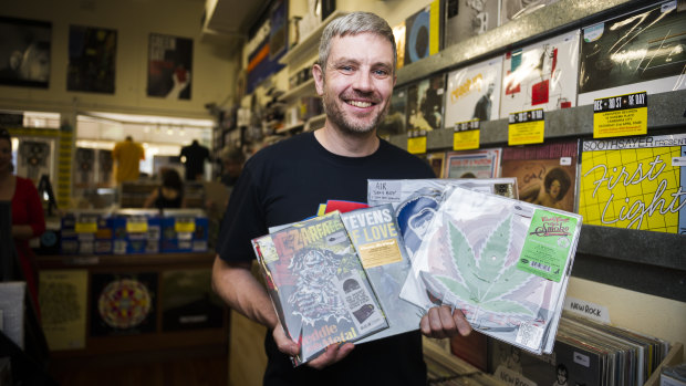 Landspeed Records owner Blake Budak holds some of the limited release records his store will have on sale for Record Store Day on Saturday.