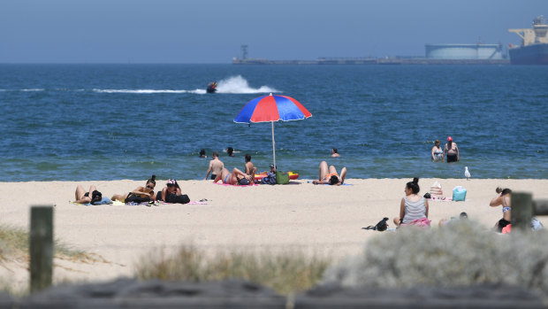 Beachgoers at Port Melbourne beach on Thursday.