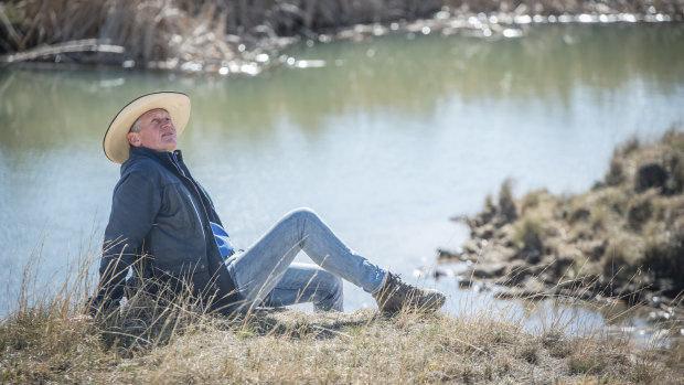 Braidwood farmer Martin Royds beside his new dam, dug two weeks ago, which immediately started to fill up with groundwater.
