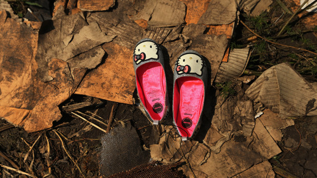 A pair of shoes from passengers' luggage lay among the wreckage of the cockpit from Malaysian flight MH17 in 2014. 