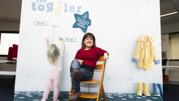 Peta Stammell in front of The Toggler, which acts as a light switch extender for children or adults.