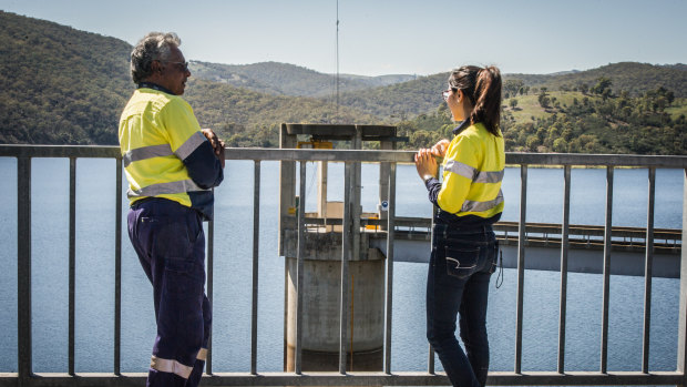Icon Water water industry operator Siva Preeyadarshanan and operations process engineer  Alice Liao check levels in the Googong Dam last Wednesday.