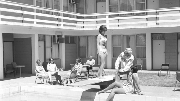 Alice Springs, 1970. “A man kicks back in a freshly ironed pair of slacks, while a woman in a bikini wonders why he’s wearing a woollen jumper,” notes Tim Ross.