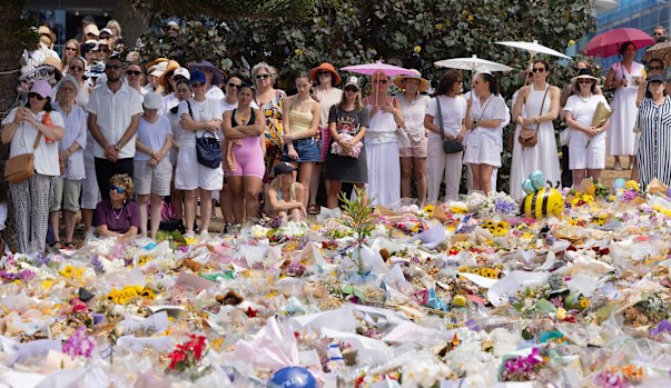 People pay their respects at Bondi on Sunday’s national day of reflection.