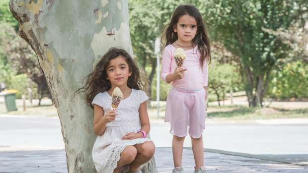Zahlia Lufti, 6, and her sister Harlow, 3, enjoy a gelato at Manuka while their mum buys an ice-cream birthday cake.