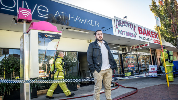 Owner Dimitri Yianoulakis outside Olive at Hawker on Wednesday morning after the restaurant was damaged by fire overnight.