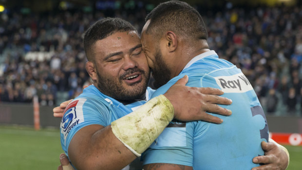 Pure joy: Tolu Latu, left, and Sekope Kepu embrace after the Waratahs booked their place in the Super Rugby semi-finals.