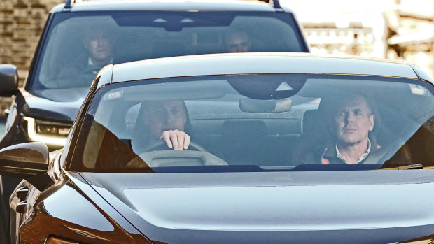 Britain's Prince William, left, leaves a London clinic on Thursday, January 18.